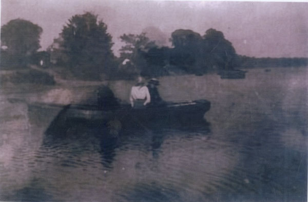 Undated copy of a photograph of a boat on the River Cleddau with Georgie Palmer and his sister � a schoolteacher in it